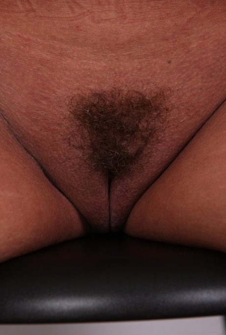 Mature woman Eva uncovers big naturals as she gets naked for the first time