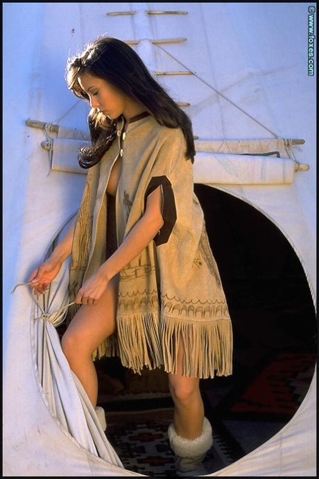 Solo girl Linda Oneil emerges from a tipi before baring her great body