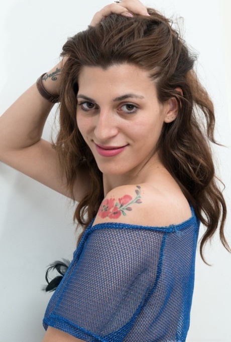 Brunette with saggy tits Johaquina flaunting her massive hairy coochie