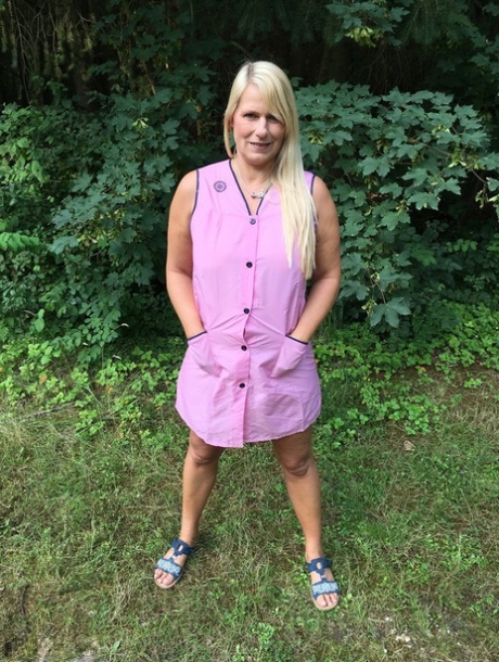 Older blonde amateur Sweet Susi exposes herself in a rural driveway