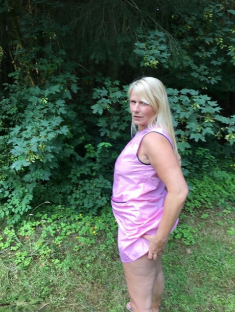 Older blonde amateur Sweet Susi exposes herself in a rural driveway