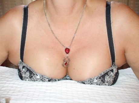 Mature amateur Busty Bliss unveils natural tits as she gets ready to suck cock