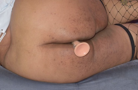 Obese ebony amateur Curvy Bunny B dildos her vagina in fishnets