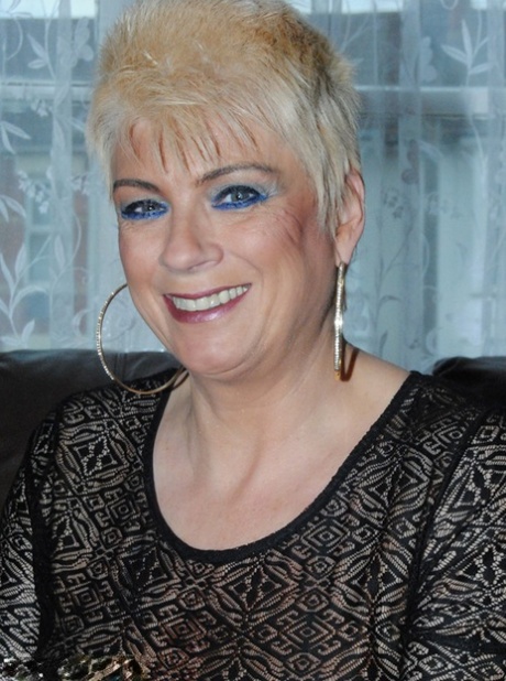 Middle-aged amateur Dimonty models nude in hosiery before getting dressed
