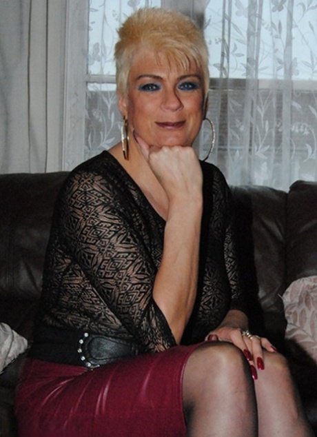 Middle-aged amateur Dimonty models nude in hosiery before getting dressed