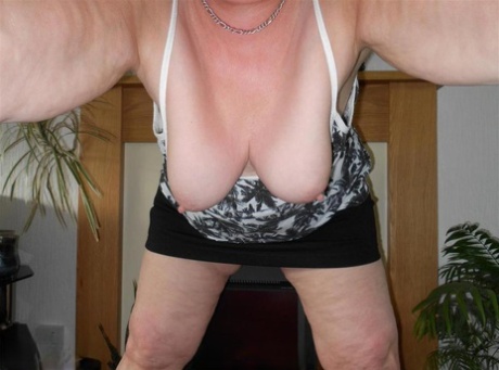 Older redhead Valgasmic Exposedabres her tits and twat while taking selfies