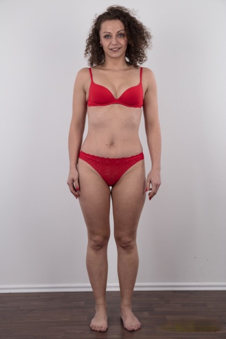 First timer with curly hair gets naked before a close-up of her bald pussy
