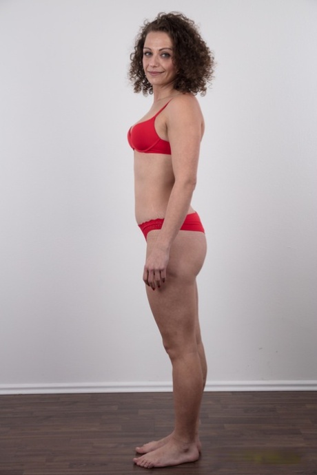 First timer with curly hair gets naked before a close-up of her bald pussy