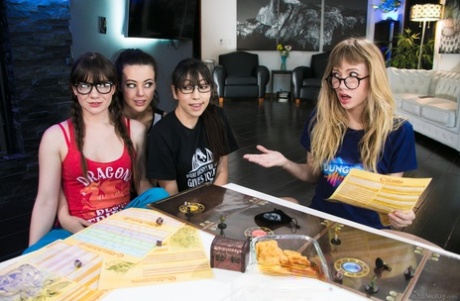 Nerdy girls have a lesbian foursome after playing a board game