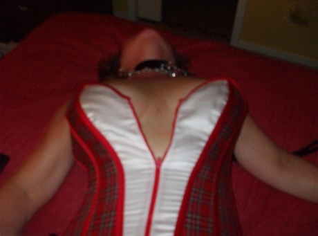 Mature lady Busty Bliss sports nipple clamps after being handcuffed