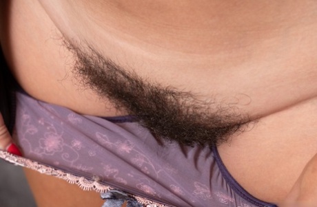 Tall female Gadget uncups her big naturals before spreading her trimmed muff
