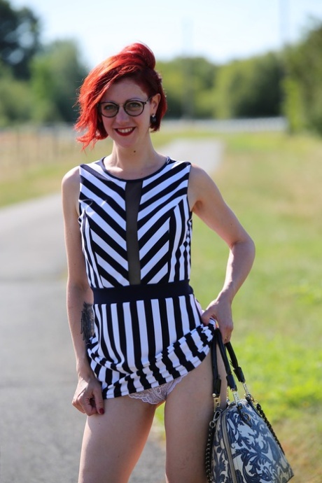 Redhead amateur has sex with two boys after exposing herself while hitchhiking