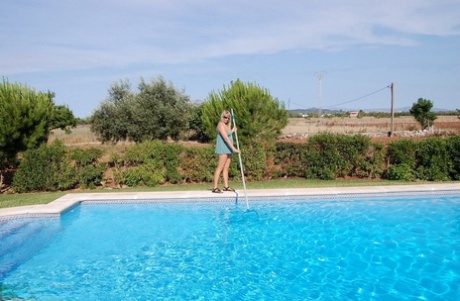 Blond amateur Sweet Susi gets naked in shades after cleaning her swimming pool