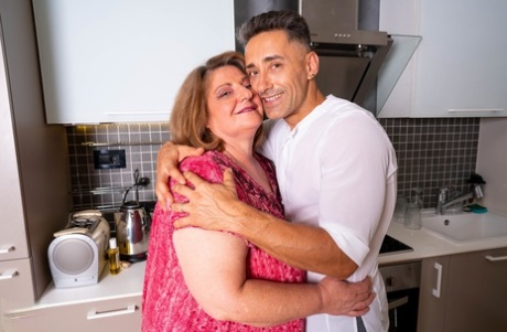 Obese mature woman gets banged on a leather sofa by a physically fit man