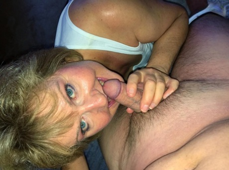 Older blonde Busty Bliss licks a dick after loosing her big natural tits