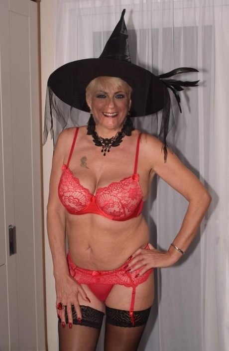 Older blonde Dimonty goes nude in nylons while sporting a witch's hat