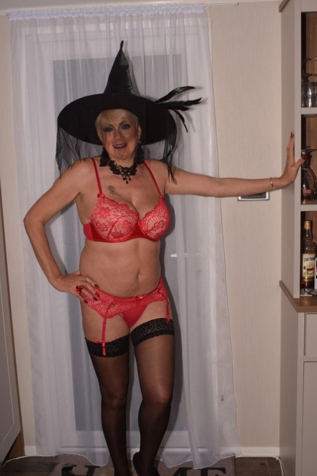 Older blonde Dimonty goes nude in nylons while sporting a witch's hat