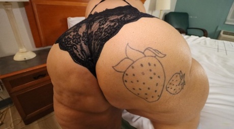 SSBBW Strawberrys Delight shows her massive ass in black lingerie