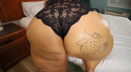 SSBBW Strawberrys Delight shows her massive ass in black lingerie