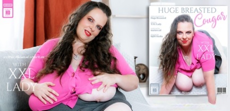 Mature fatty masturbates with a sex toy during solo action on a sofa