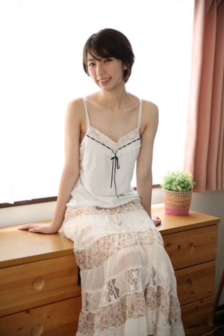 Japanese girl spreads her bush while completely naked before dressing
