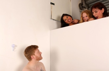 British ladies spy on a guy before giving him a CFNM handjob