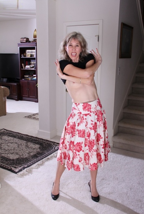 Mature babe Olive Jones shows her pantyhose that hiding that pussy