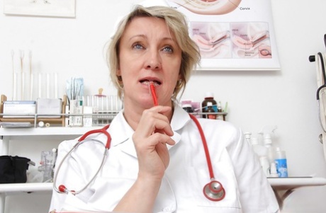 Close up masturbating scene features mature cutie Ester in uniform