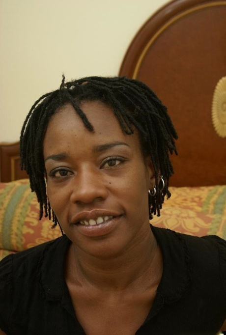 Mature ebony Cat is undressing her lingerie and playing with tits