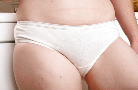 Redheaded wife Ana Molly posing in white panties before revealing beaver