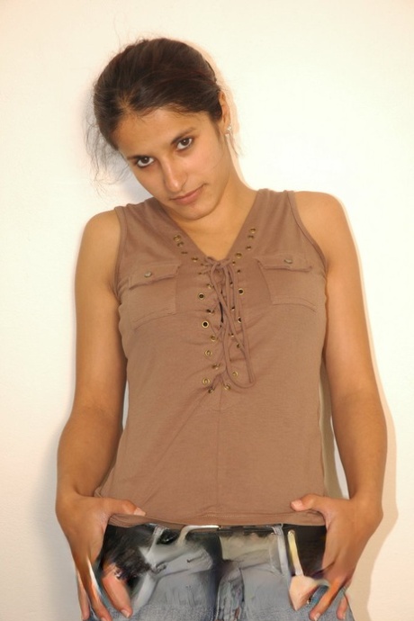 Brunette solo model Demia doffs jeans and shirt to pose in the nude