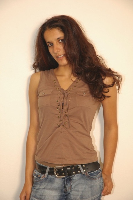 Brunette solo model Demia doffs jeans and shirt to pose in the nude