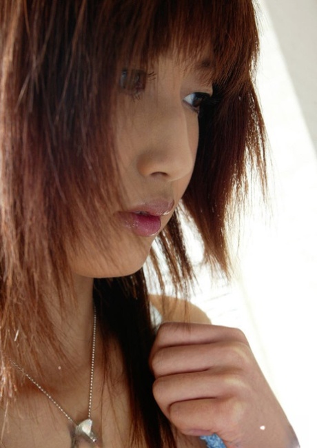 Busty asian teen babe Mio Komori slipping off her lingerie
