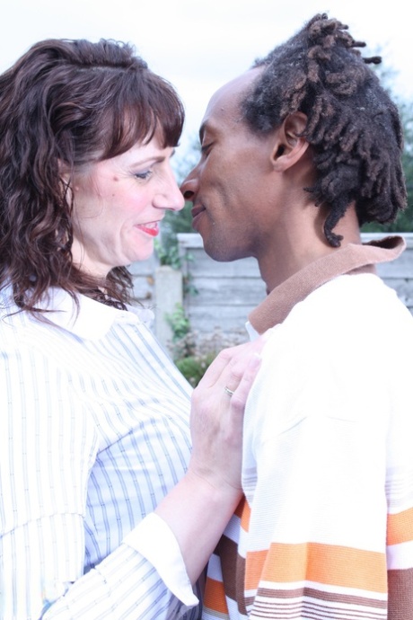 Horny British mature Toni Lace kisses a black dude and rides his huge boner