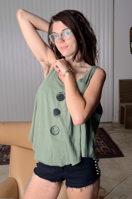Nerdy brunette Valkyree Jaine spreading her very hairy pussy wide open
