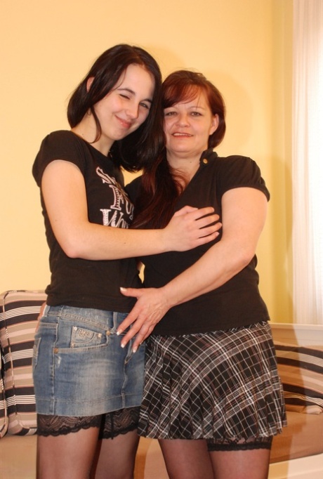 Mature lesbian Eden strips young teen Jarolina and licks and fucks her pussy