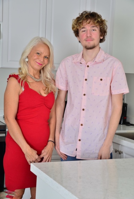 Blonde mature in a red dress Jynn Daor seduces a young guy and gets rammed