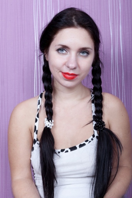 Dirty girl with pigtails Tanita reveals her big tits and toys her hairy cunt