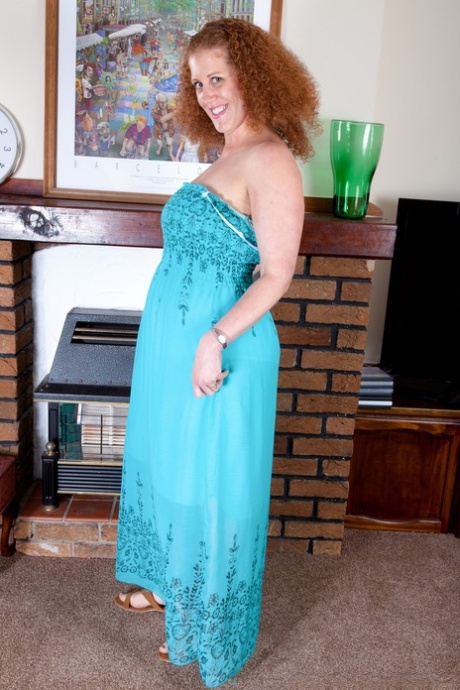 Chubby mature with large breasts Francesca May shows her curvy body
