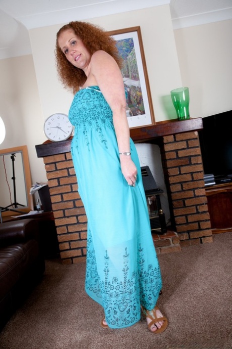Chubby mature with large breasts Francesca May shows her curvy body