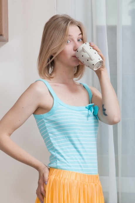 Naughty Ukrainian housewife Kristinka rubs her meaty hairy twat in the kitchen