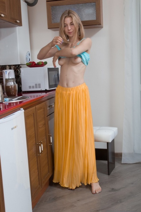 Naughty Ukrainian housewife Kristinka rubs her meaty hairy twat in the kitchen