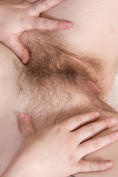 Older lady Teddy SnowFlower reveals her hairy pits and bush as she disrobes