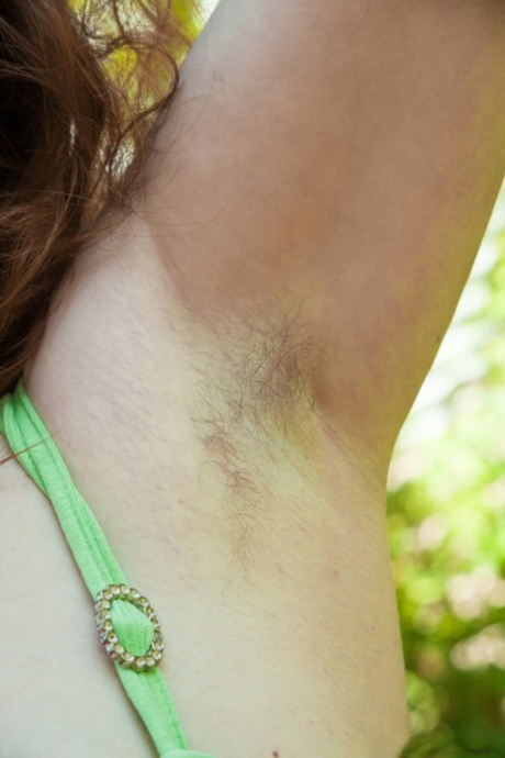 Busty mature Bazhena displays hairy armpits outdoors & flaunt natural pussy