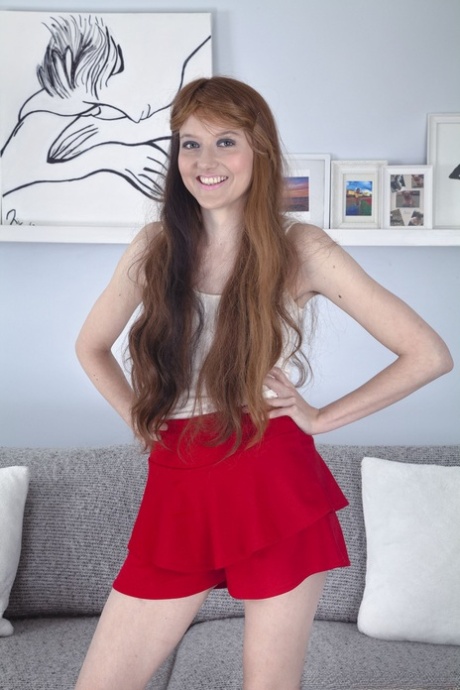 Smiley ginger Emma Valentine unveils her unshaved armpits and fuzzy vagina