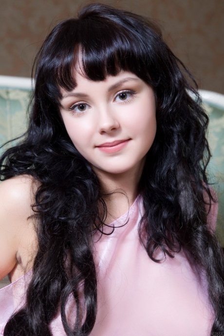 Sweet teen with an adorable face Mirelle A flaunts her amazing tits in a solo