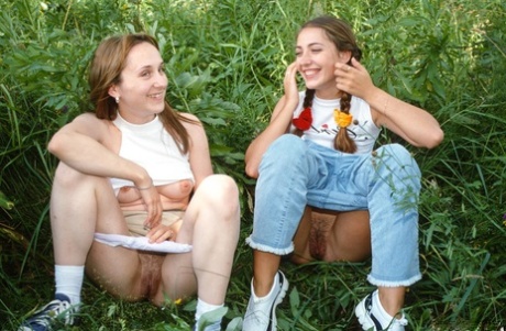 Skinny teens Sylvia F and Judy I reveal their fantastic butts in the woods