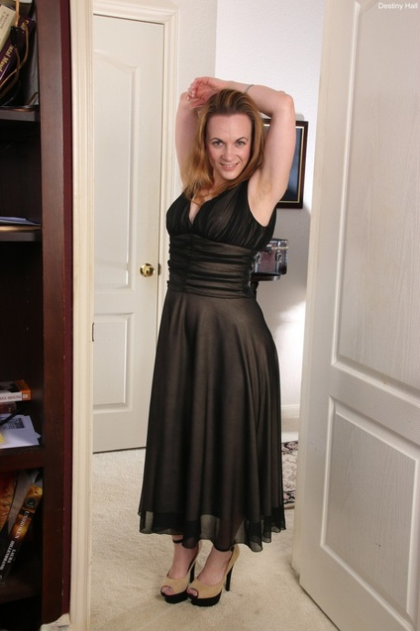 Mature amateur Destiny Hall doffs her elegant dress and rubs her juicy cunt