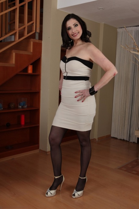 Hot Italian MILF Barbarella spreads her hairy twat while teasing in stockings