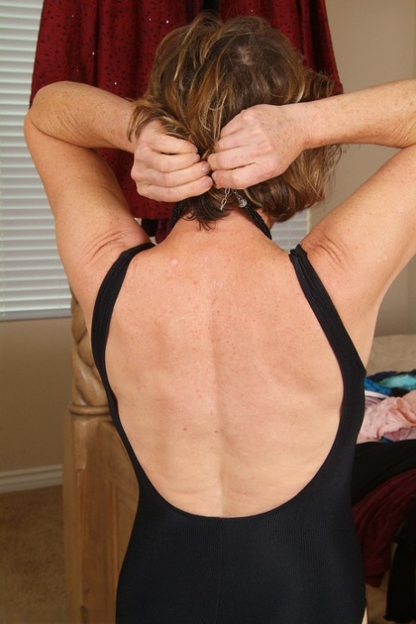 Gorgeous mature lady Judy exposes her hairy crotch while changing